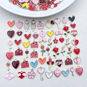 Flat lay of Valentine heart and rose charms with colorful enamel finish for DIY jewelry