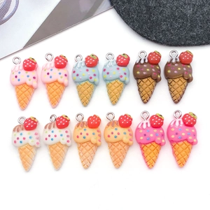Detailed macro view of twelve resin strawberry ice cream cone charms for DIY jewelry making
