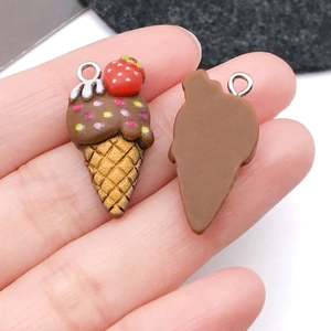 Detail of DIY strawberry ice cream resin charms for keychains with waffle cone texture