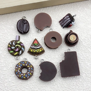 Detailed close-up of resin miniature dessert charms with metal rings for DIY jewelry making