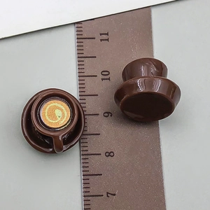 Detailed macro view of 1.5cm miniature coffee cup model with latte art and resin saucer