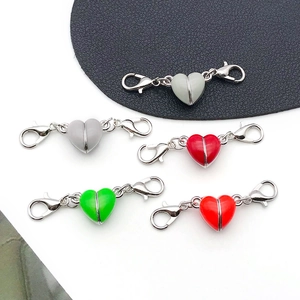 Detail view of colorful heart-shaped magnetic jewelry clasps for DIY necklaces and bracelets