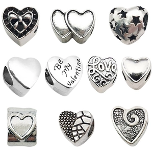 Vintage silver heart-shaped alloy beads set with hollow design and engraved love patterns