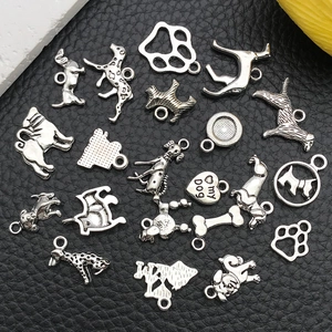 Detailed collection of silver alloy dog charms and bone pendants for DIY jewelry making