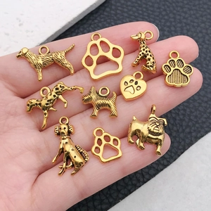 Vintage golden alloy dog and paw charms collection for DIY jewelry making and necklaces