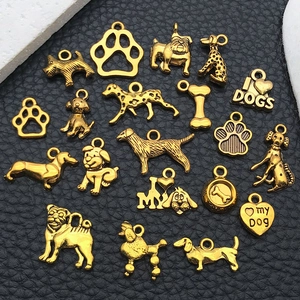 Assorted gold vintage alloy dog charms with bone and paw motifs for DIY jewelry making