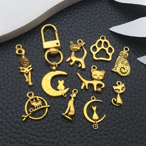 Golden cat alloy pendants set with assorted feline charms and keychain accessories