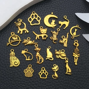 Collection of 20 gold cat-themed alloy pendants for DIY jewelry making on leather