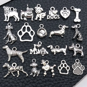 Antique silver dog charms set featuring various breeds and paw prints for DIY jewelry making
