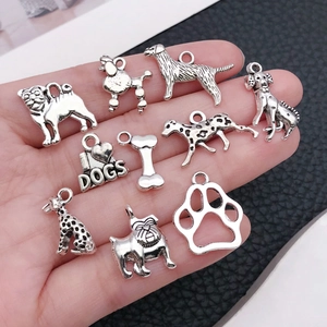 Antique silver dog charms including poodles and bones for DIY jewelry making and crafts