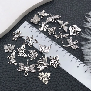 Antique silver insect charms including butterflies, bees, and dragonflies for DIY jewelry