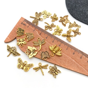 Antique gold insect pendants including butterflies and bees for DIY jewelry making