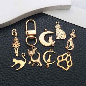 Lot de 9 breloques chat et patte en alliage doré pour la fabrication de bijoux DIY