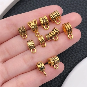Antique gold alloy bail beads and pendant connectors in various vintage floral designs