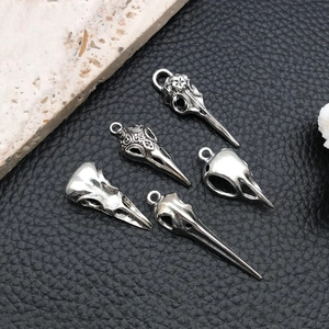 Set of five gothic silver bird skull pendants for DIY jewelry with detailed carvings
