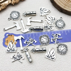 Antique silver fire department charm set with fire hydrant and extinguisher pendants