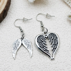Detailed view of vintage silver alloy angel wing and hollow heart asymmetric earrings