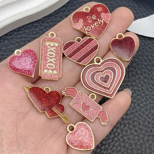 DIY Valentine's Day alloy charms with red pink heart and XOXO patterns for jewelry making