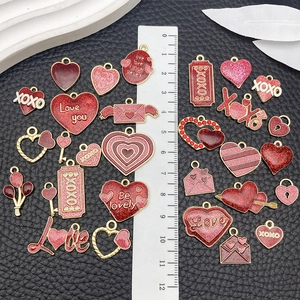 Red and pink enamel heart charms for DIY jewelry making with gold-tone alloy finish