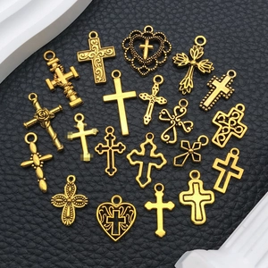 Golden vintage cross charms set in various religious styles for DIY jewelry making