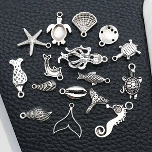 Detailed set of 15 antique silver ocean charms featuring seahorses and starfish for DIY crafts
