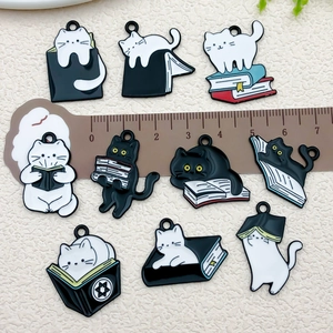 Set of 10 cute black and white enamel cat and book charms for DIY jewelry making
