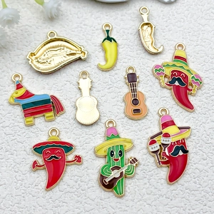Detail of Mexican style alloy enamel charms featuring cactus, chili and guitar for DIY crafts