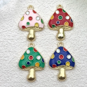 Close-up of colorful mushroom alloy pendants for DIY jewelry making and craft projects