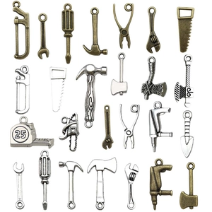 Assorted mini metal tool pendants for DIY jewelry and keychains in silver and bronze finish