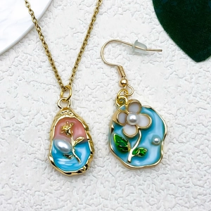 Macro shot of Monet oil painting style enamel pearl pendant and earring set