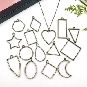 Macro detail of various bronze geometric alloy frames for DIY resin jewelry making