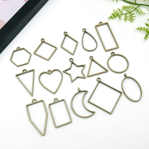 Macro view of 15 pieces of assorted bronze geometric hollow metal frames for DIY jewelry crafts