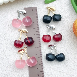 Realistic resin cherry charms in pink and red with metallic leaves and measuring scale