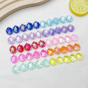 Close-up of iridescent ABS petal beads in multiple colors for DIY jewelry making