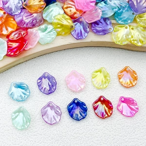 Detailed view of colorful iridescent ABS petal charms with hanging holes for DIY jewelry