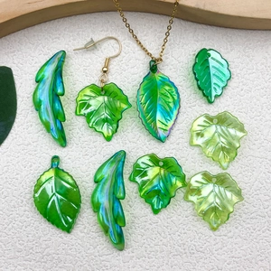 Iridescent green resin leaf charms and handmade jewelry accessories for DIY crafts