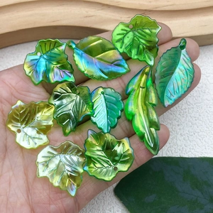 Green iridescent leaf charms in various shapes for DIY handmade jewelry and beaded crafts
