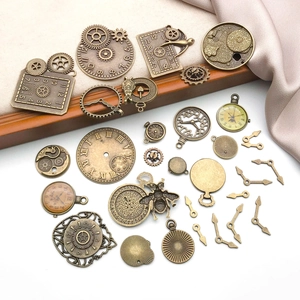 Detail of vintage steampunk bronze clock charms, gears and insect pendants for DIY jewelry