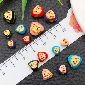 Colorful heart enamel beads with cartoon faces and golden details for DIY jewelry making
