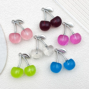 Detailed view of colorful 3D cherry pendants with silver leaves and glitter resin