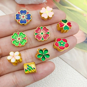 Perles de fleurs en émail doré de style chinois traditionnel pour la création de bijoux