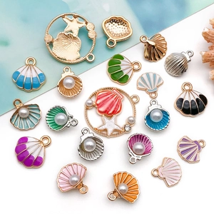 Detail of colorful enamel sea shell and starfish alloy pendants for DIY jewelry making