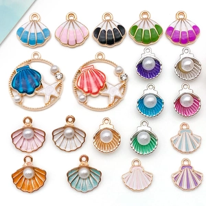 Macro shot of colorful enamel starfish and seashell charms for DIY jewelry making