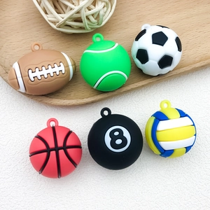 Close-up of sports ball charms including football and basketball PVC keychain pendants