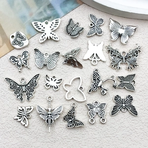 Detailed collection of antique silver butterfly charms with hollow and embossed designs
