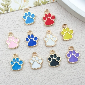 Detailed view of colorful enamel cat paw charms for DIY jewelry making and crafts