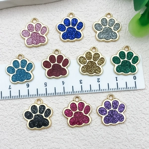 DIY colorful glitter cat paw alloy pendants in multiple colors with ruler for size reference