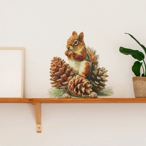 Self-adhesive wall sticker featuring realistic squirrels and pinecones in home interior