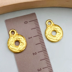 Goldene runde Hohlperlen mit Drachenrelief für die DIY Schmuckherstellung