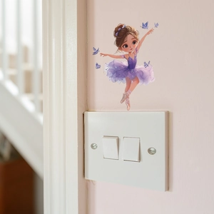 Cartoon dancing girl wall sticker with purple butterflies above a white light switch